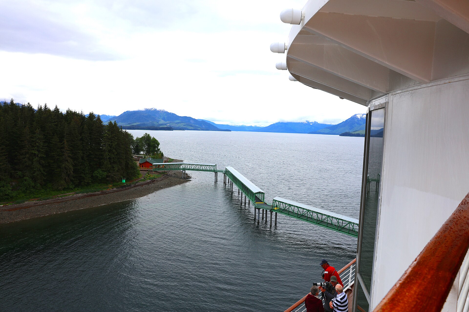 Historic cannery, excursion dock, and evergreen rainforest shore at Icy Strait Point, Hoonah