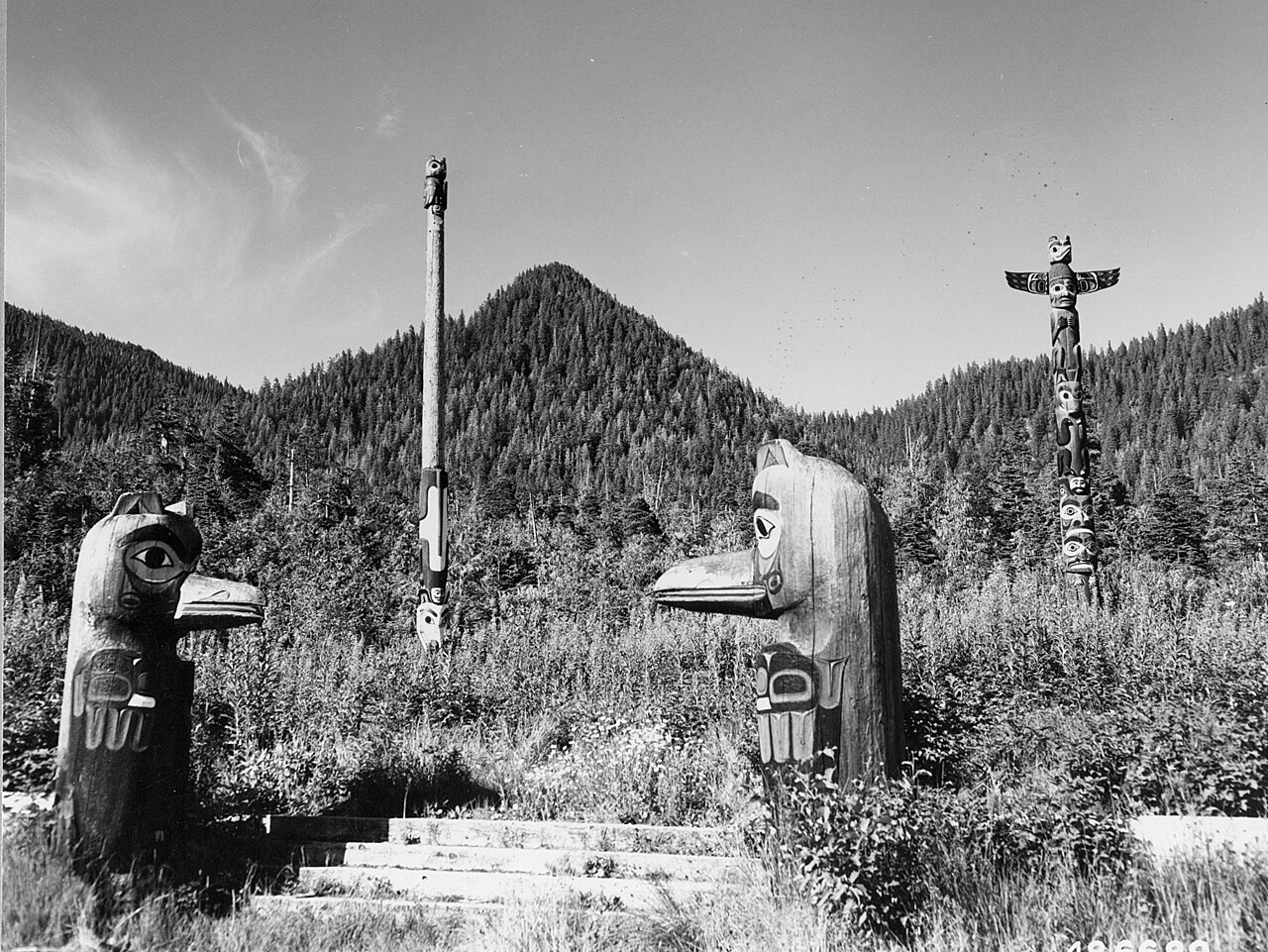 Carved cedar totem poles standing at Saxman Native Village
